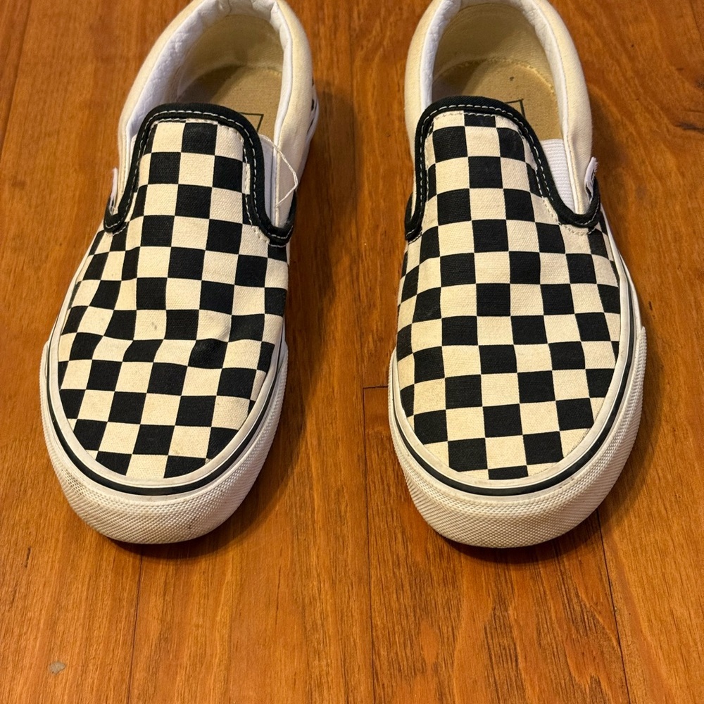 Vans Black and White Checkerboard Slip-On Sneakers